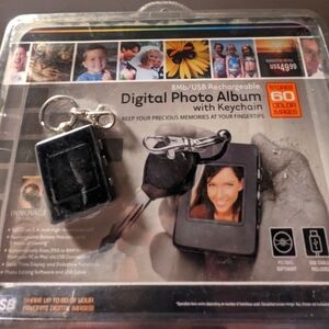 Never opened. Digital photo album with keychain
